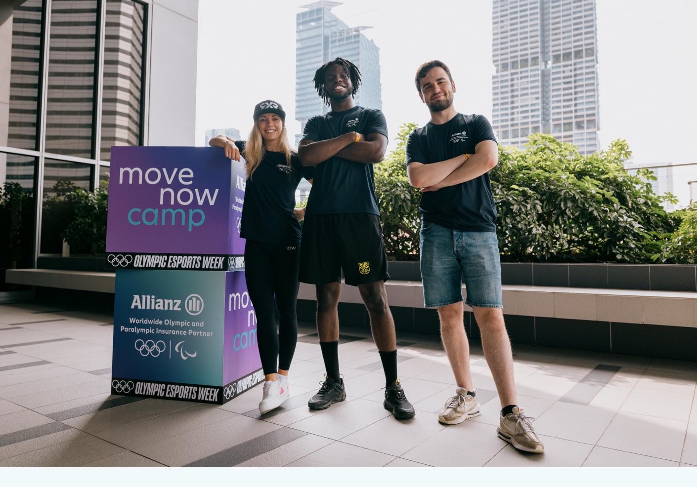 The coaches  of the MoveNow camp Mikaela Åhlin-Kottulinsky, Kassio and Sv2 standing next to each other in Singapore.